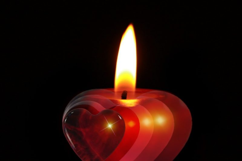photo of a candle with a flame