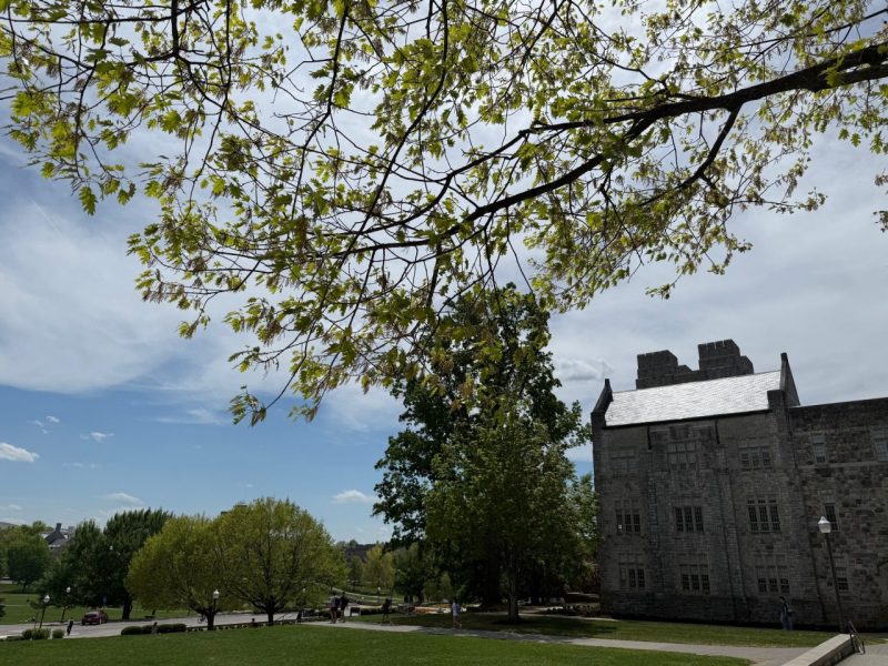 Burruss Hall with side view of spring greenery 