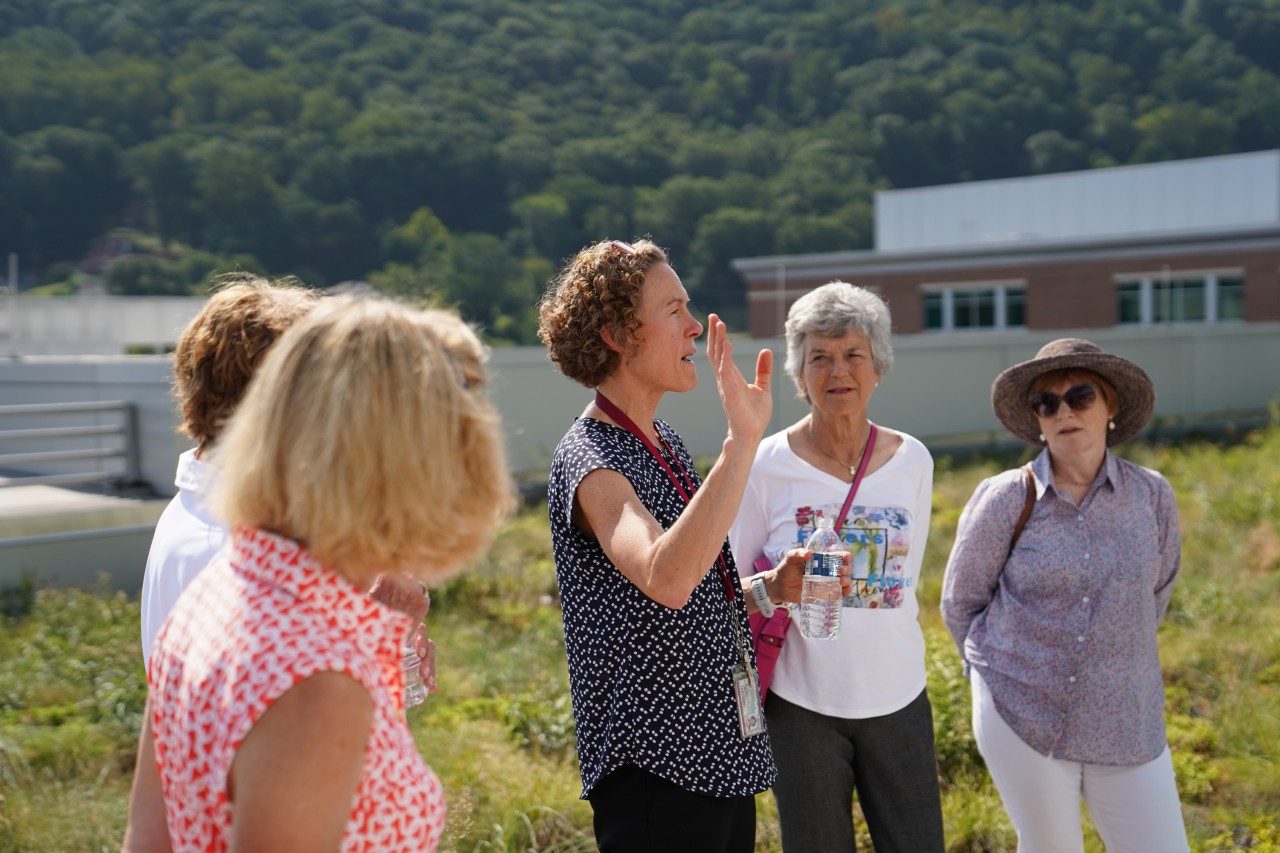Sarah Glenn, associate director of facilities development and technical operations, explains how the green roof slows the flow of rainwater into Roanoke's stormwater system and the Roanoke River, reducing pollution.