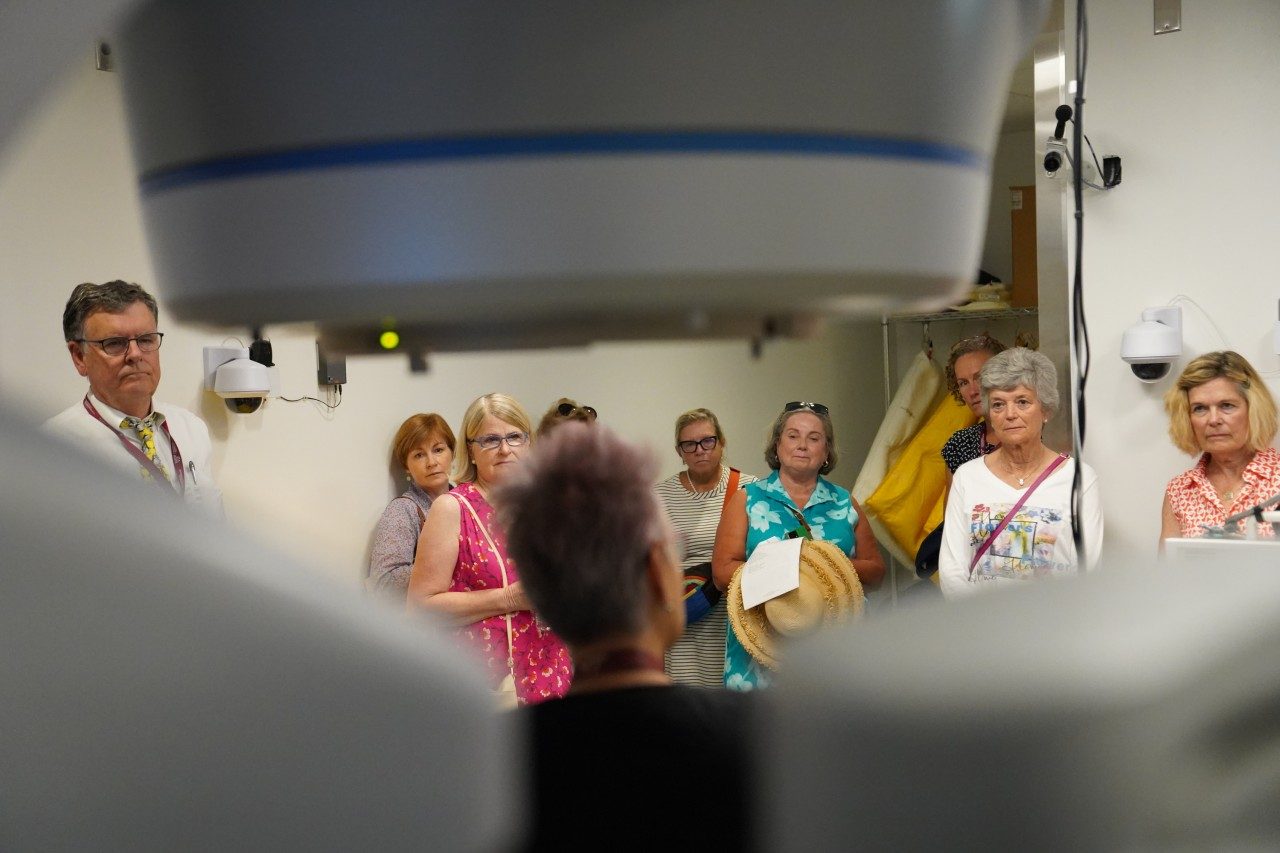 Garden club members learn from radiation therapist MeLora Bush (at center) how dogs and cats are treated using a linear accelerator in the Virginia-Maryland College of Veterinary Medicine's Animal Cancer Care and Research Center.