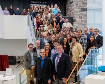 Warren Bickel (front, center) poses with speakers and attendees at a Festschrift Symposium celebrating his distinguished career at the Fralin Biomedical Research Institute at VTC in September.  Photo by Clayton Metz for Virginia Tech.