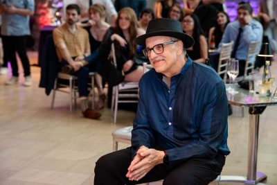 Warren Bickel listens to speakers at a Fare Thee Well party he hosted at the Taubman Museum of Art in Roanoke in June. Photo courtesy Keely Massie.