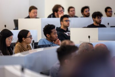 group of people listening to a lecture