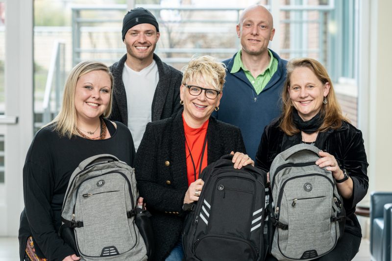 Group of 5 people with backpacks
