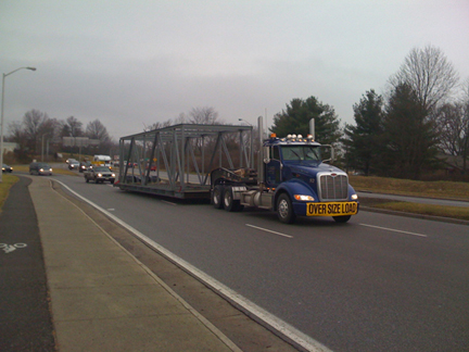 Virginia Tech Solar House is transported by truck.