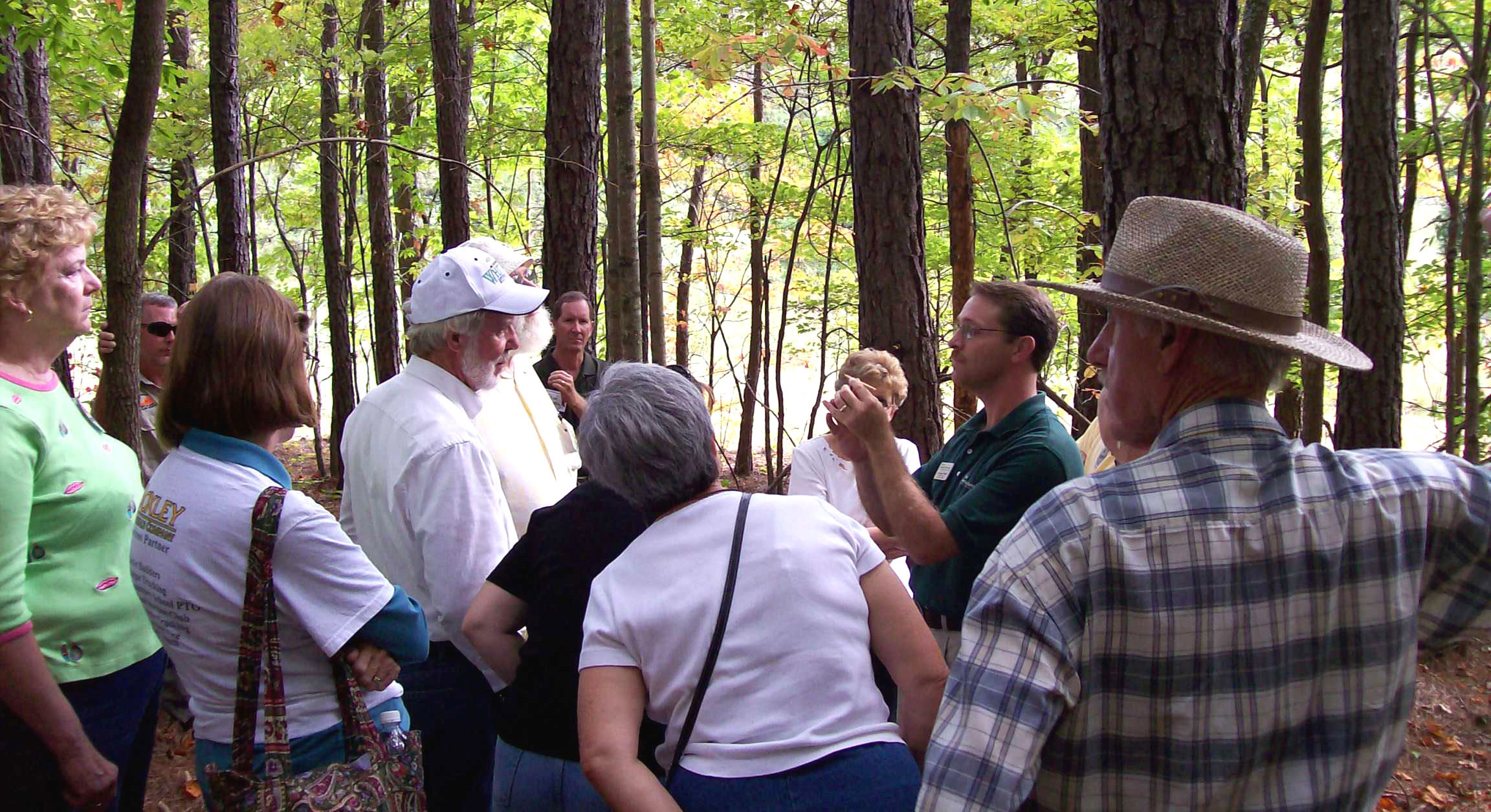Extension Agent Jason Fisher teaches students how to read tree rings during the optional field trip portion of the Online Woodland Options for Landowners course.