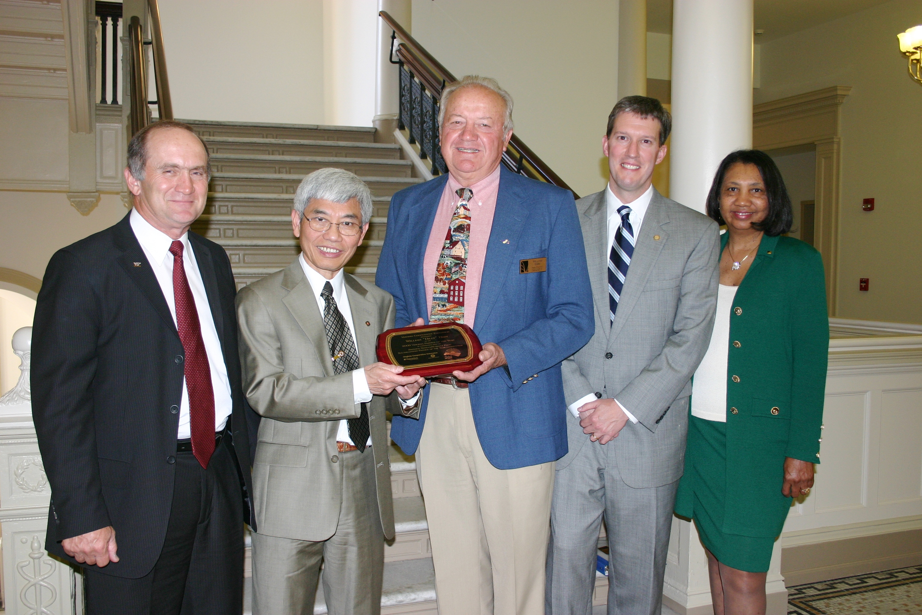 Virginia Cooperative Extension recognized William “Billy” Bain, of Dinwiddie (center) as the 2009 Virginia Farmer of the Year at a meeting of the Virginia Board of Agriculture and Consumer Services on May 21 in Richmond. Pictured from left to right: Jim Riddell, assistant director of agriculture and natural resources for Virginia Cooperative Extension; Loke Kok, interim dean of the College of Agriculture and Life Sciences; Billy Bain; Todd Haymore, commissioner of the Virginia Department of Agr
