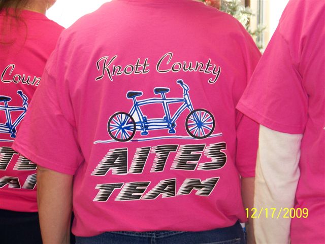 The tandem bike metaphor is displayed on the back of the Knott County, Ky., community cohort team T-shirt.