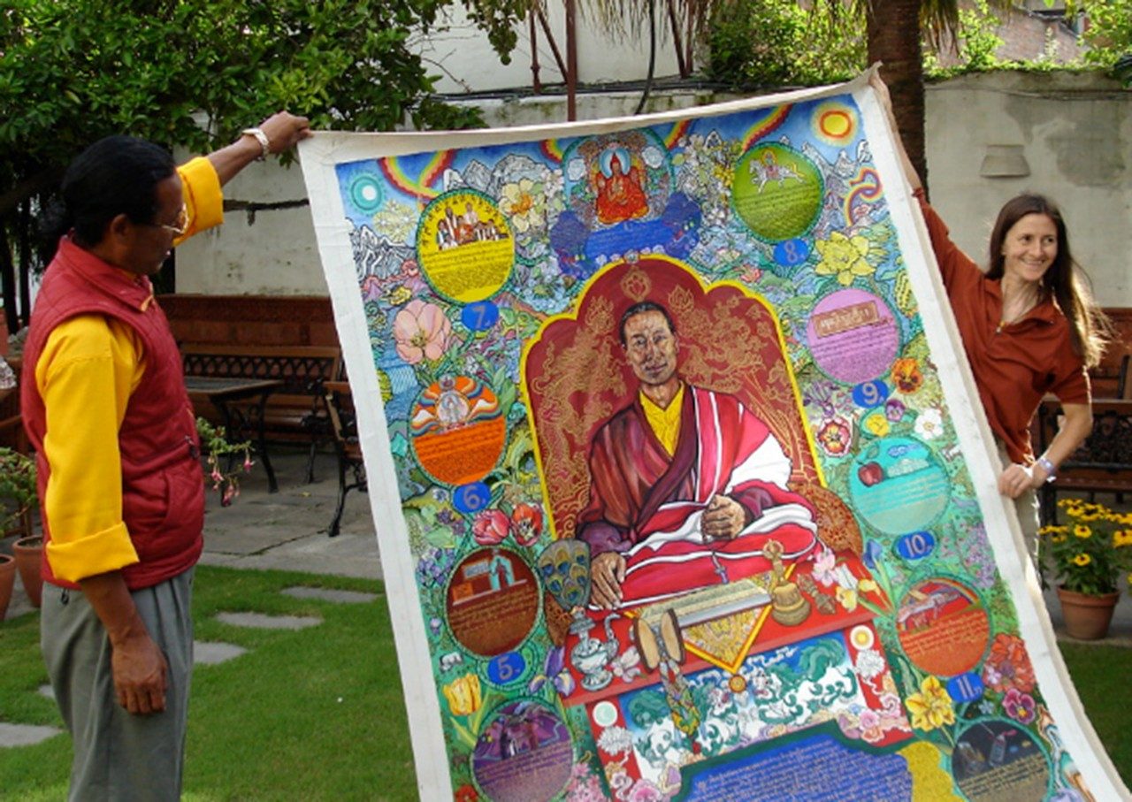 Tsampa Ngawang Lama (left) holds his lineage portrait with Jane Vance