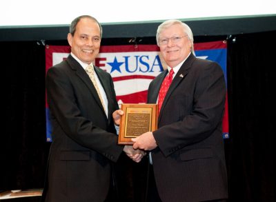 Saifur Rahman at left receives award from Jim Howard