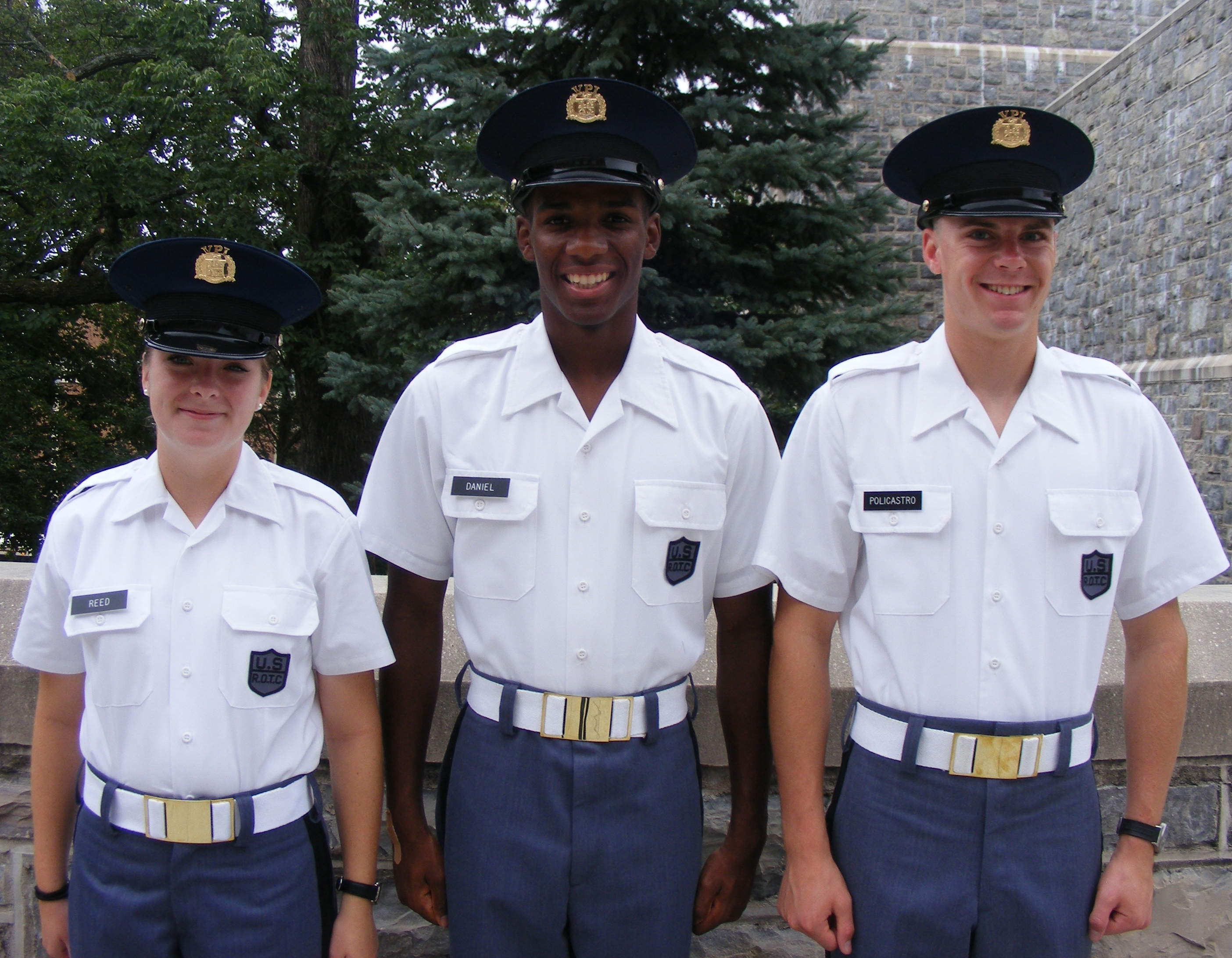 From left to right standing in front of Torgerson Hall are Cadets Samantha Reed, Lyndon Daniel, and Carlo Policastro
