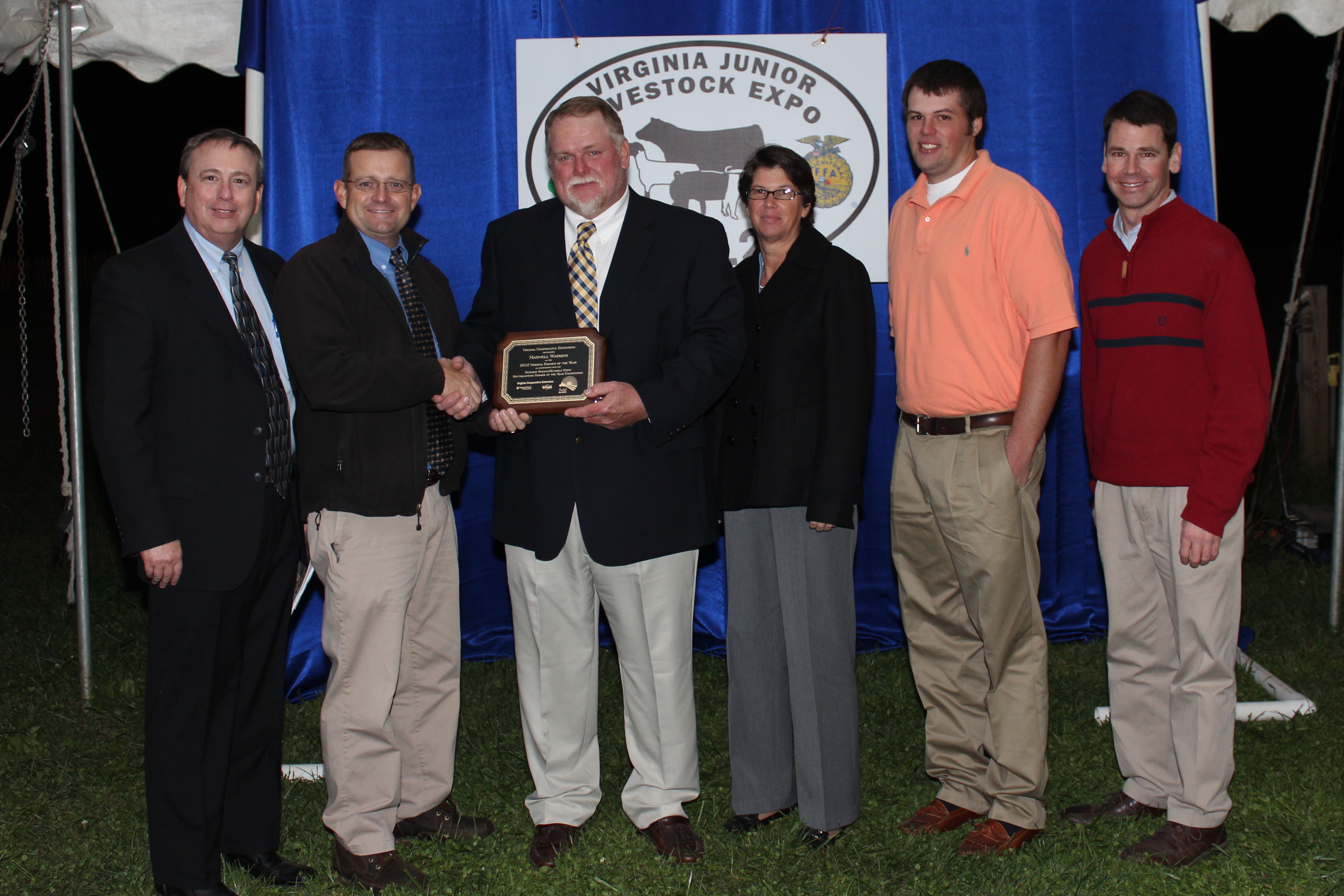 The Farmer of the Year award is presented to Maxwell Watkins.