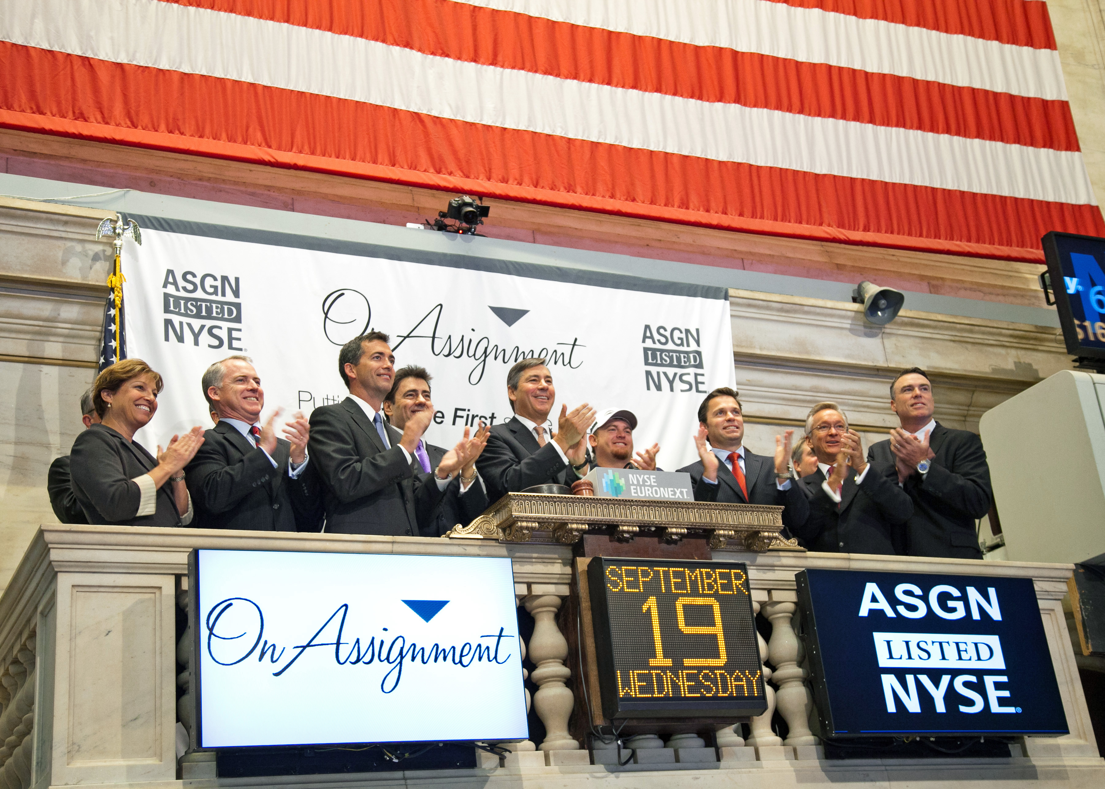Jeff Veatch and others celebrate after ringing the opening bell at the New York Stock Exchange.