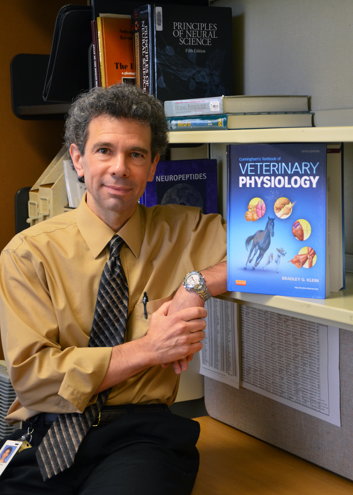 Bradley G. Klein with physiology textbook