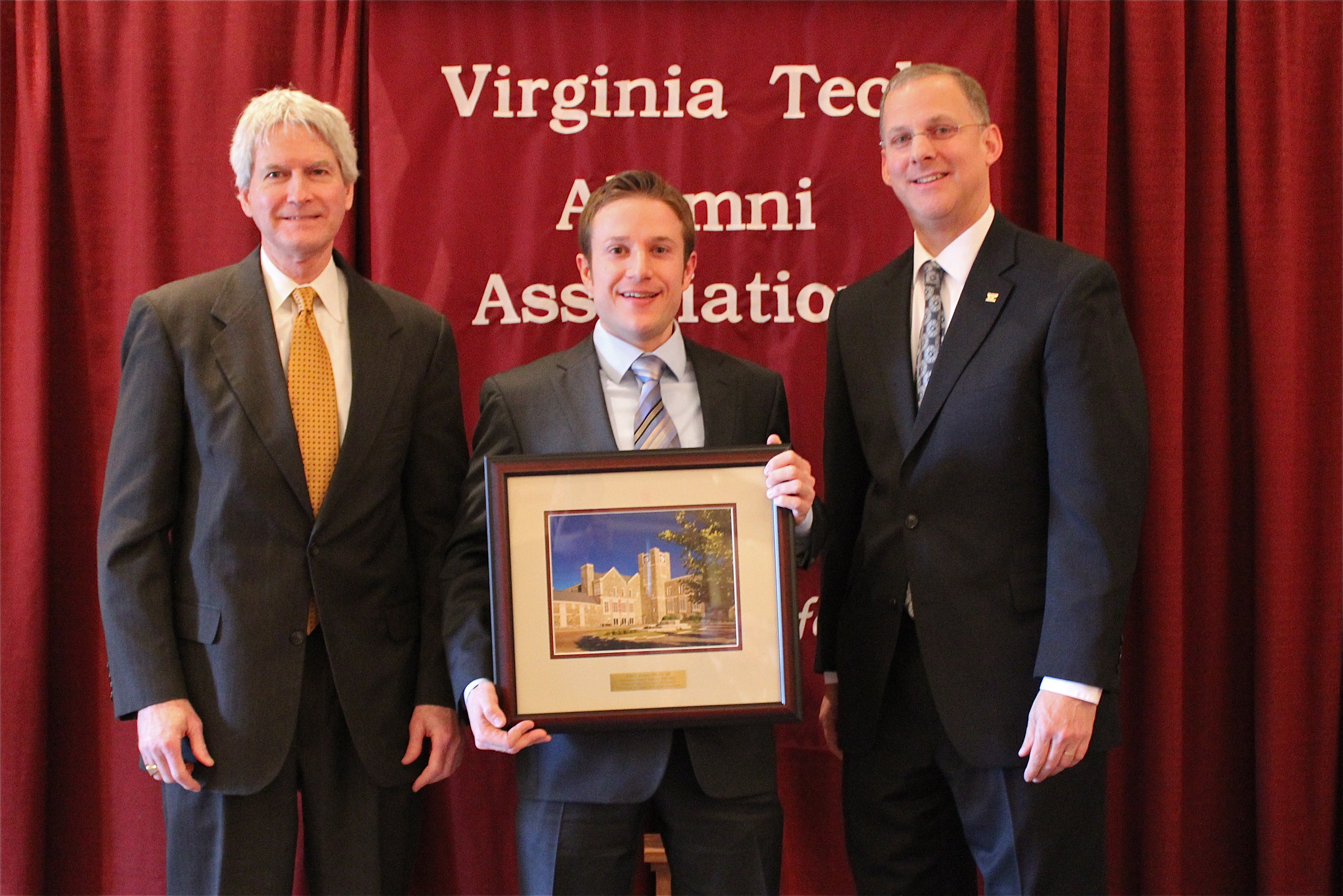 Thomas Tiller, vice president for alumni relations, and Alan Grant, dean of the College of Agriculture and Life Sciences, present John L. Koontz of Oak Park, Ill. with the annual Outstanding Recent Alumni Award.