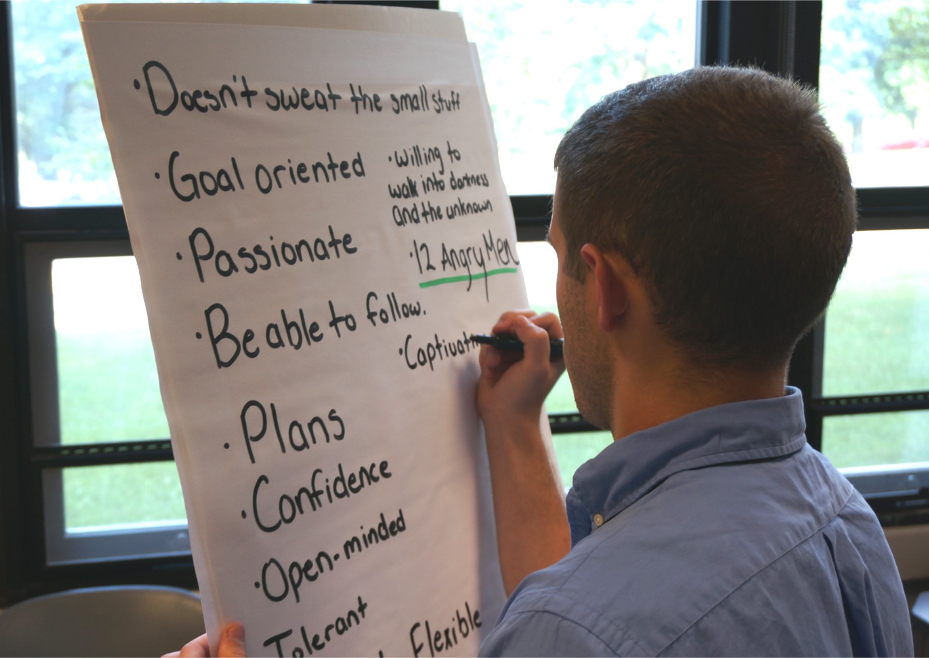 Austin Sears, of Manassas, Va., works on a leadership attributes exercise during a Pamplin program on campus this summer.