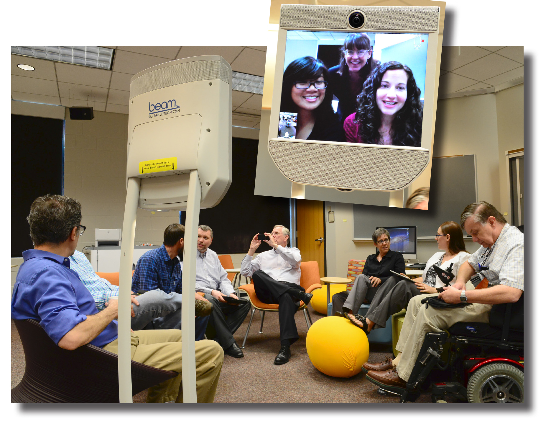 Students, staff, and faculty collaborate with offsite participants using a mobile videoconferencing device.