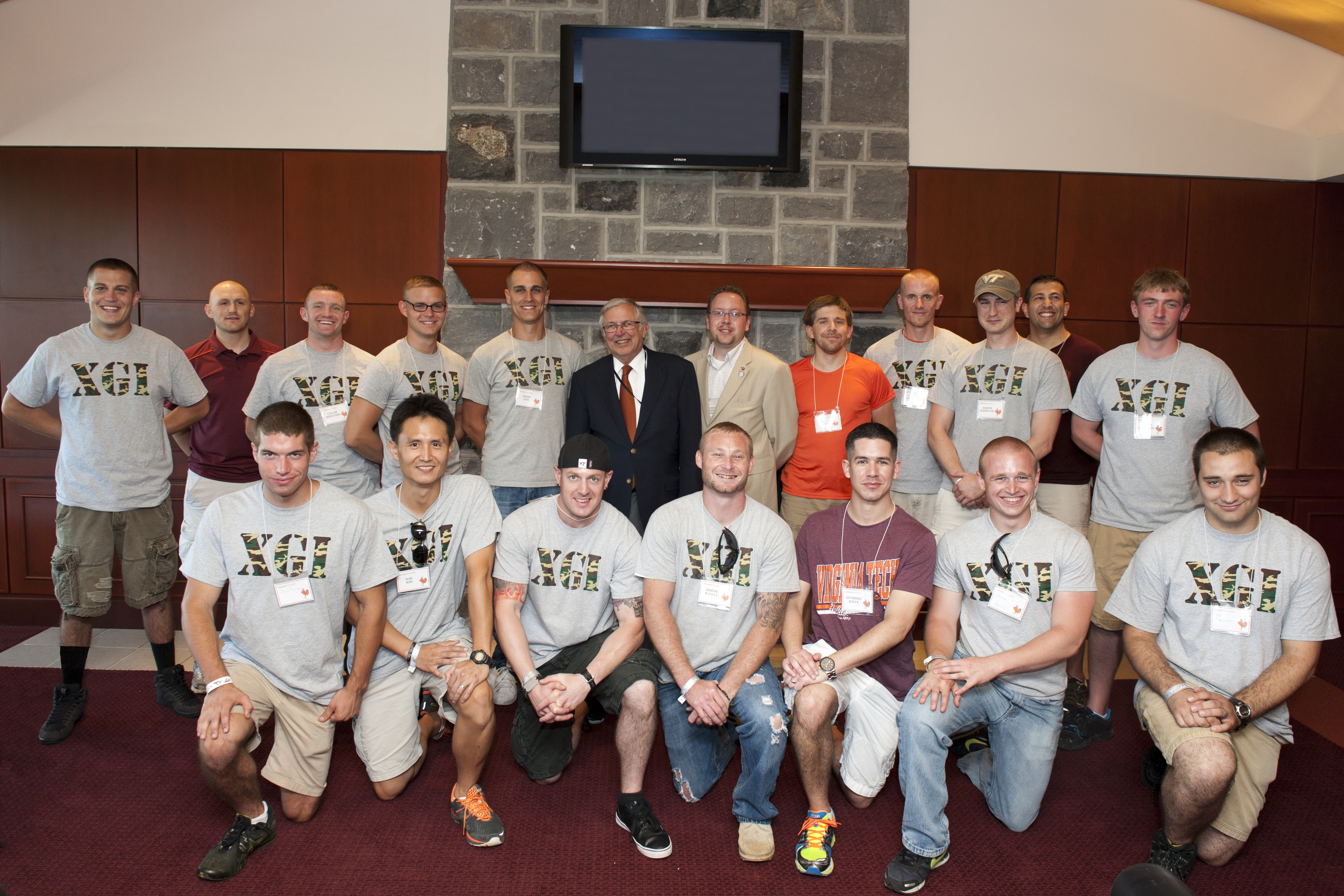 student veterans with University President Charles W. Steger during football game