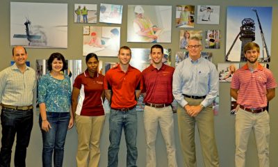 (Left to right) Andrew McCoy, Parisa Nikkhoo, Iman Elrayah, Ryan Piplico, Jeff Bonica, Chris Brandt, and Zach Wegryn at a subcontractor pre-construction conference at Hourigan Construction's Hampton Roads Office.