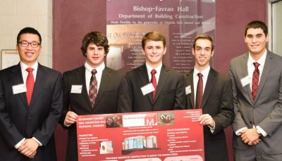 The five students on the winning team stand with their presentation board. 