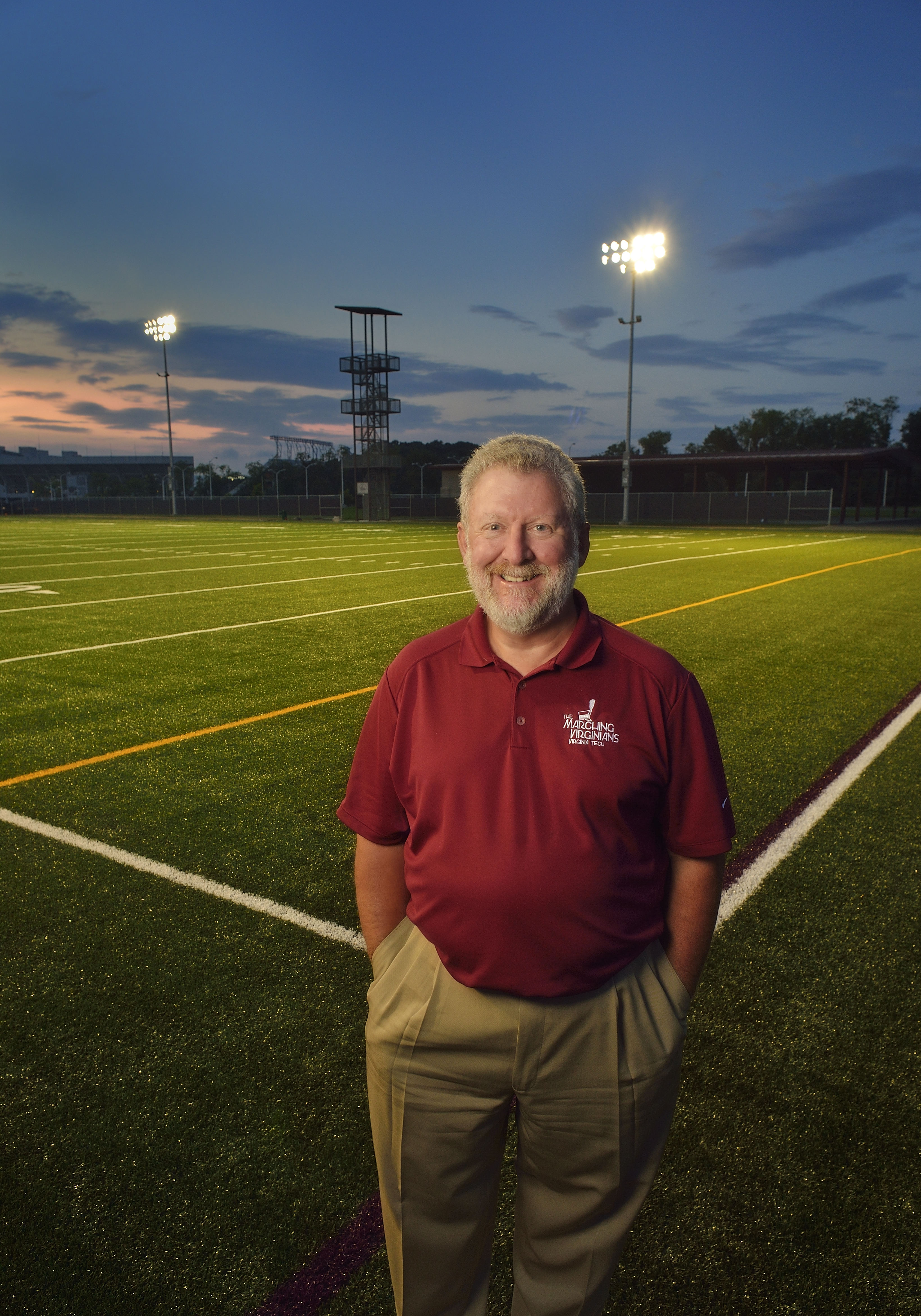 Dave McKee standing on new field for Marching Virginians