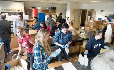 Students assemble water test kits in Durham Hall.