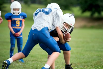 At a youth football practice in Blacksburg, the players wear instrumented helmets that record when, and how hard, they hit their heads. 