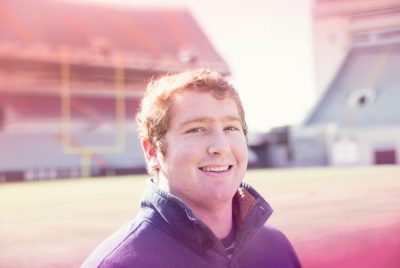 JC Fuller poses on Worsham Field in Lane Stadium on Virginia Tech's campus