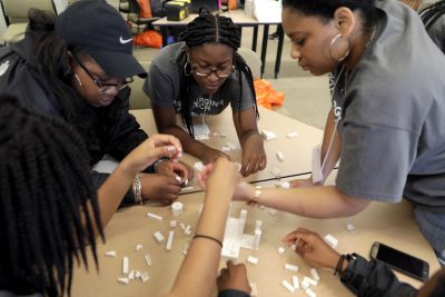 High school seniors participate in the Lego challenge in the College of Architecture and Urban Studies.