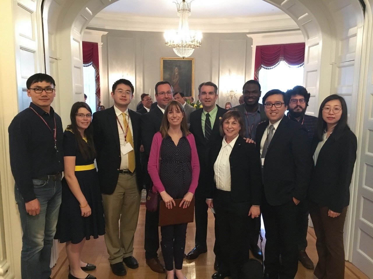 Agricultural and Applied Economics students and professors pose with Governor Ralph Northam inside the Executive Mansion.