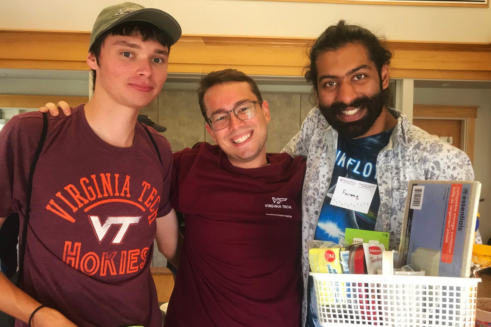 Hokie Connect mentor Mason Stoecker poses with a transfer student and a peer mentor.