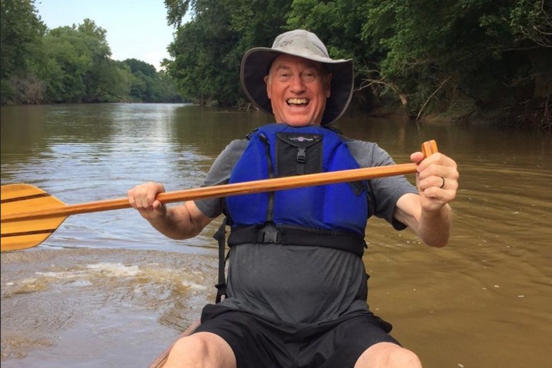 Gary Downey paddling a canoe