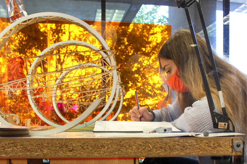 First-year architecture student Carley Parsons works at her studio desk in Cowgill Hall