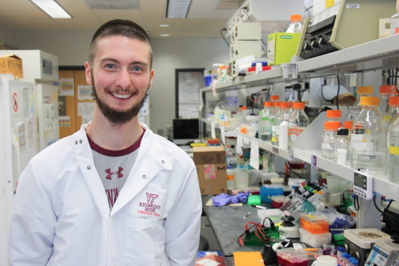 Graduate student Jesse Janoski poses inside a cancer research laboratory at Virginia Tech