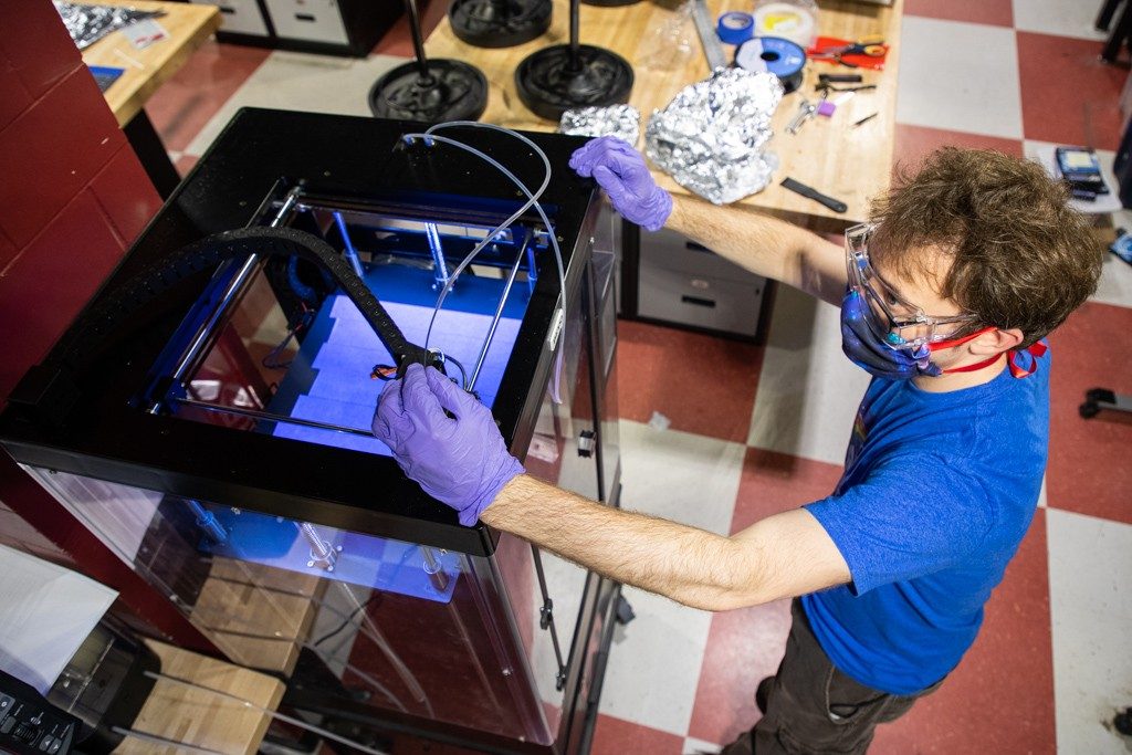 Rod LaFoy works on headbands for face shields with a Raise3D printer. Photo: Spencer Roberts for Virginia Tech