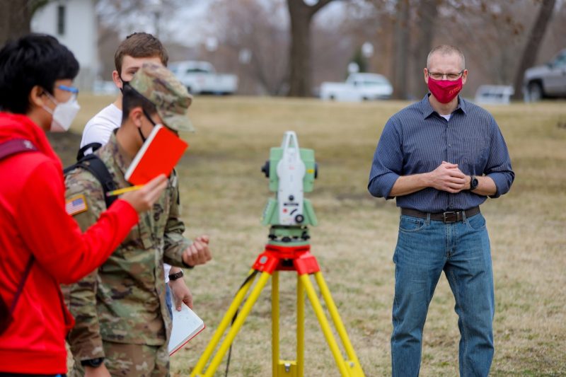 People surveying land
