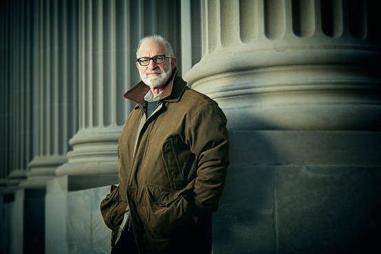 David Goldman, founder and chairman of Fellowships at Auschwitz for the Study of Professional Ethics, poses in front of columns.