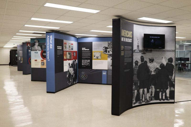 The Americans and the Holocaust exhibit is a large multipanel display on the fourth floor of Newman Library. It includes pictures, graphics, and text.