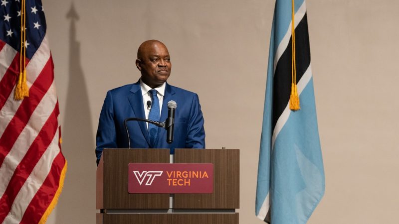 A man speaks at a podium