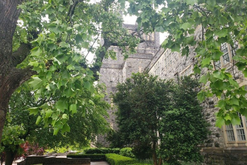 Burruss Hall with side view of spring greenery 