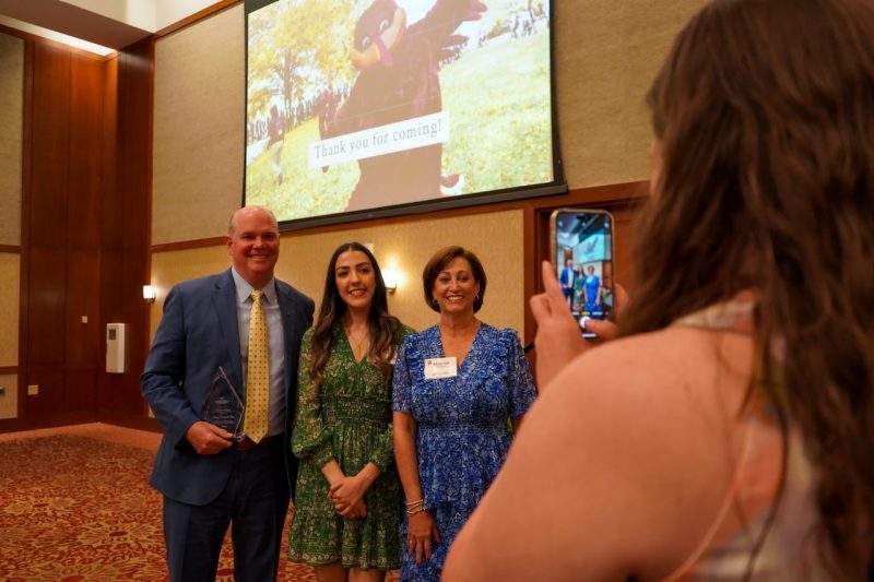 Tom Winters (far left), Shauna Winters (far right), and their scholarship recipient Marah Ghanem stand for a photo at the ISE Academy of Distinguished Alumni induction ceremony.