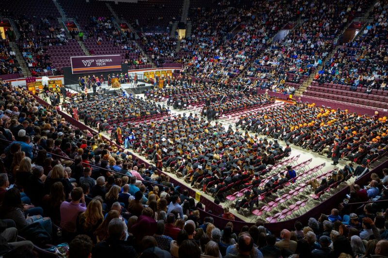 Graduates and their families sit in Cassell Coliseum during the fall commencement ceremony. Photo by Ray Meese