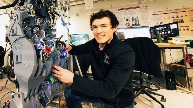 Connor Herron in the Terrestrial Robotics Engineering and Controls Lab.