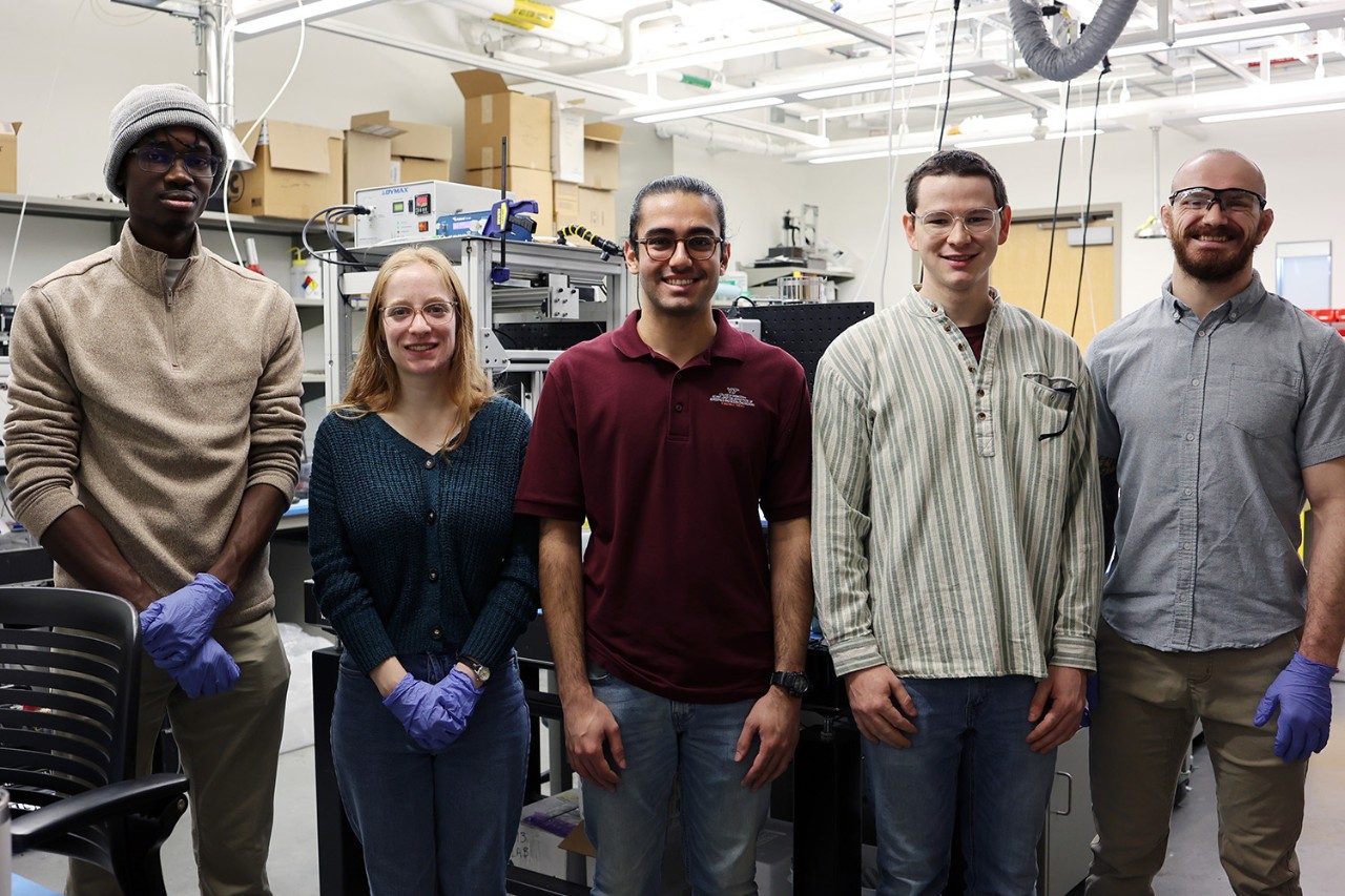 Students contributing to this research include (from left) aerospace engineering senior Giovanni Morris; civil and environmental engineering master's student Iliana Walters; aerospace engineering doctoral candidate Farideddin Bazzal; macromolecular science and engineering doctoral candidate Ray Peterson; and Polymer Composite and Materials Laboratory manager John Reynolds. Photo by Jama Green for Virginia Tech.