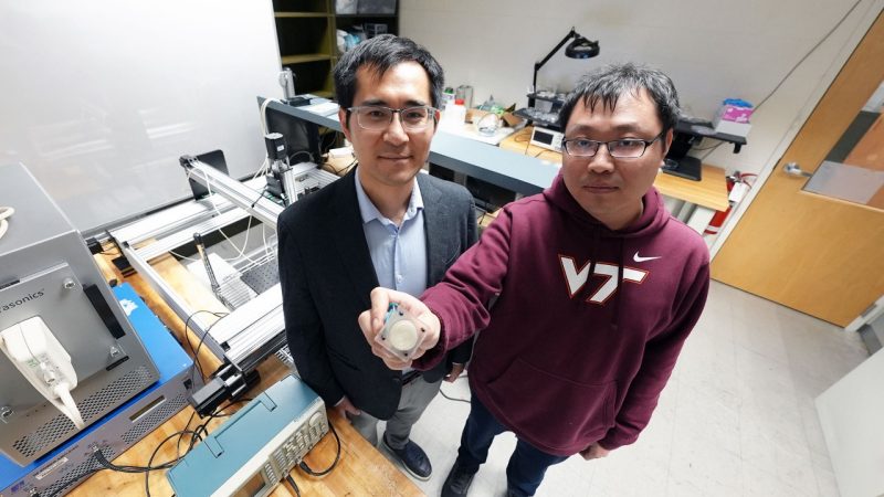 (from left) Assistant Professor Zhenhua Tian and student Teng Li with an emitter used to create an acoustic vortex. Photo by Alex Parrish for Virginia Tech.