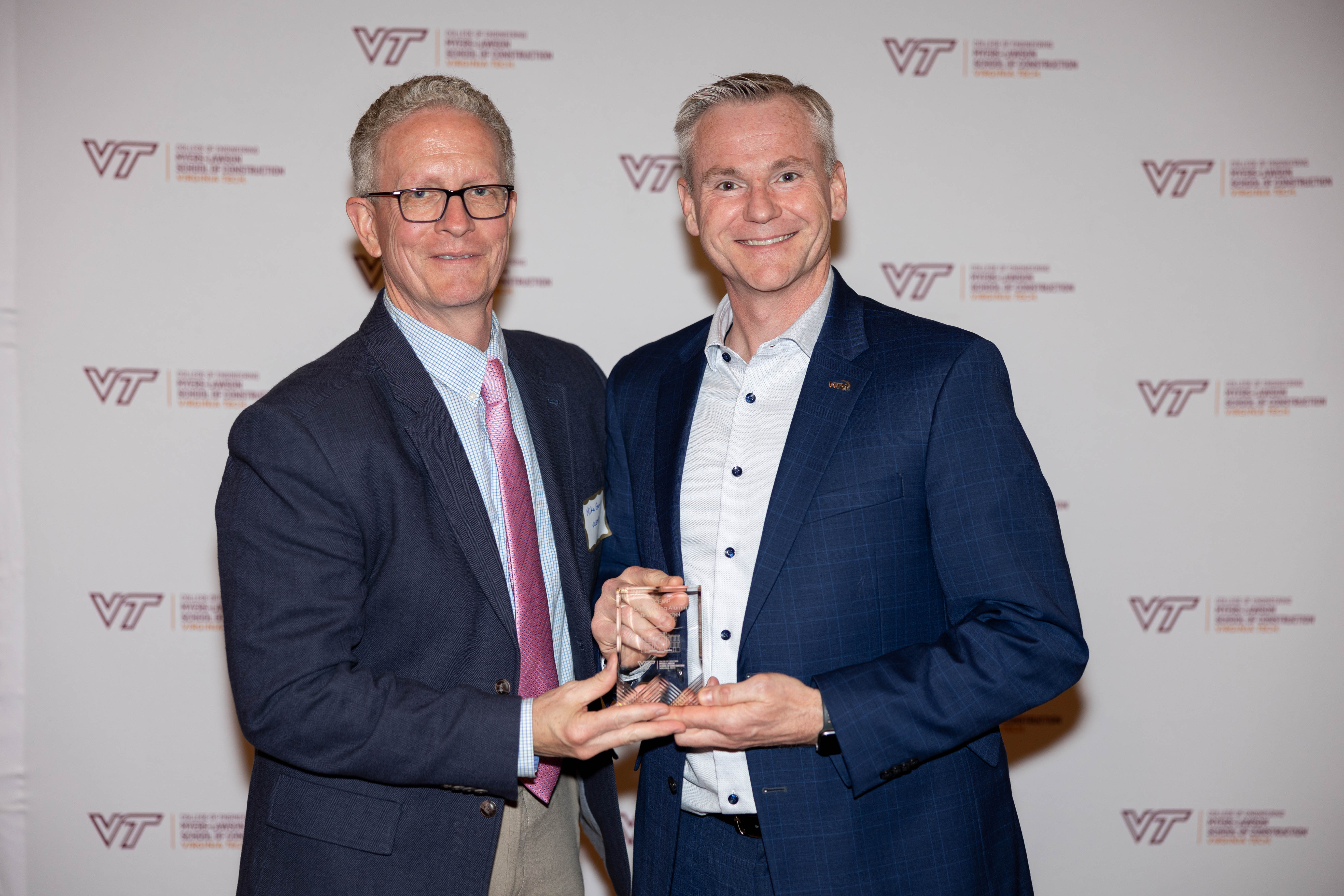 Michael Garvin (at left) with Brian Henschel ‘07. Photo by Will Drew for Virginia Tech.