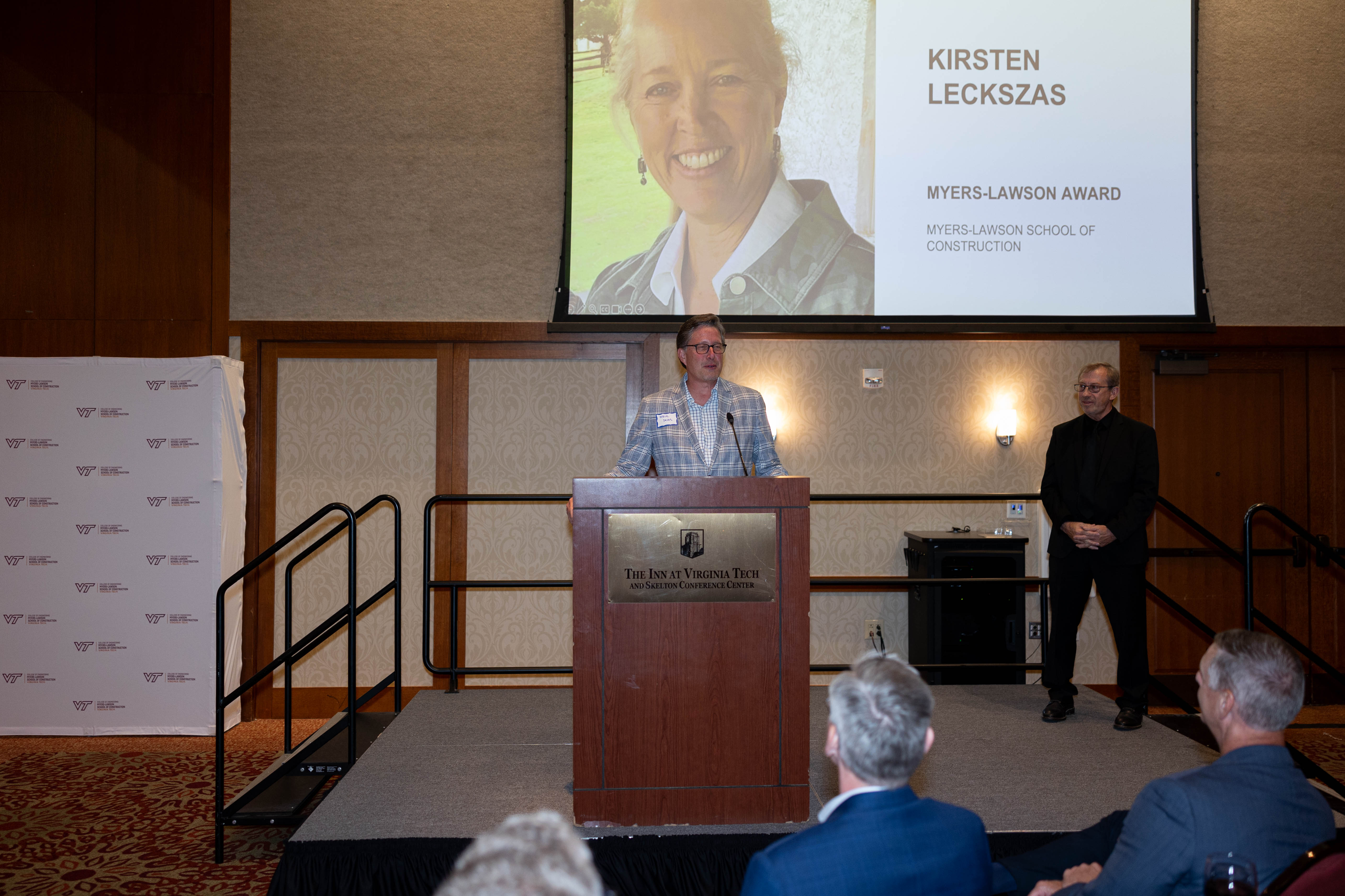 Steve Daves '89 presents Kirsten Leckszas '88 with the Myers-Lawson Award.
