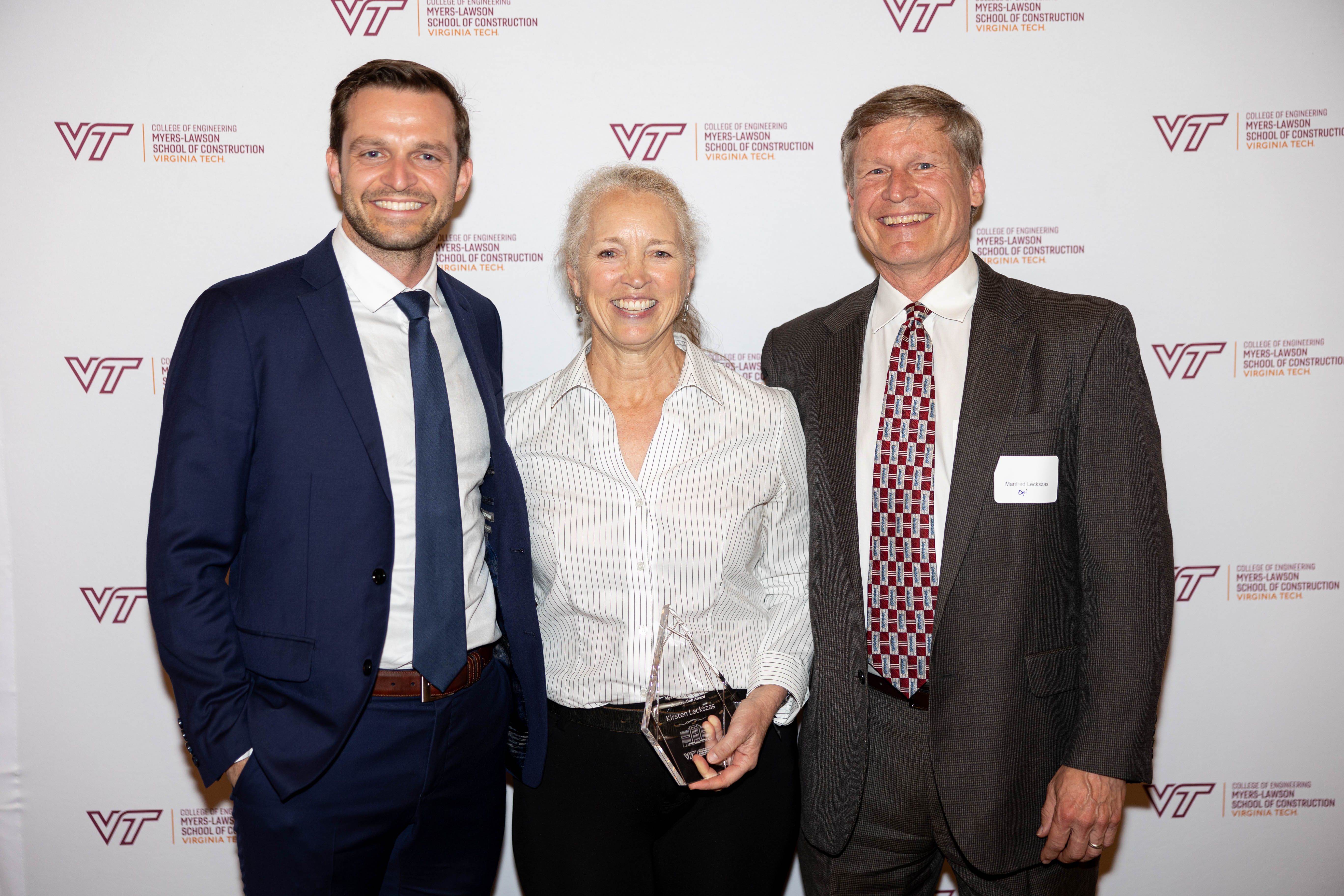 Kirsten Leckszas '88 (middle) with family during Awards Ceremony. Photo by Will Drew for Virginia Tech.