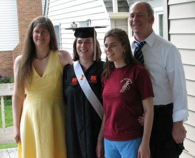 family poses for graduation photo
