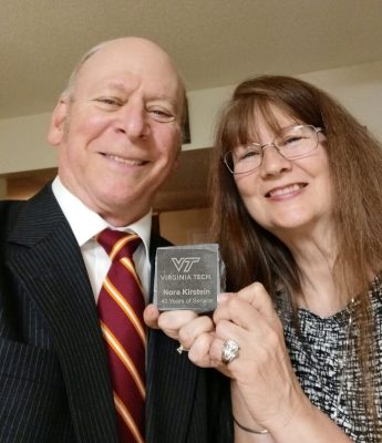 Dean and Nora Kirstein pose with stone award